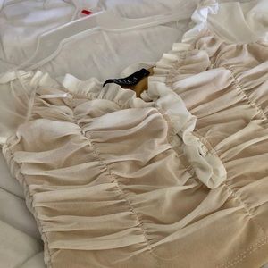 AKIRA over the shoulder top